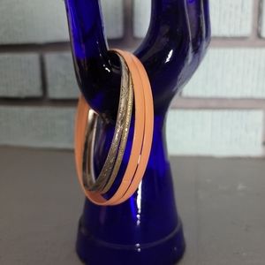 Metal and peach colored bangle  bracelets